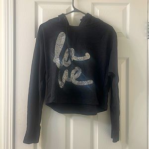 Grey hoodie written love on the front